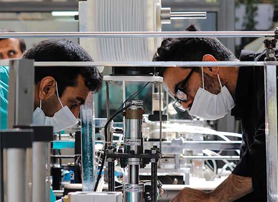 two scientists working with masks